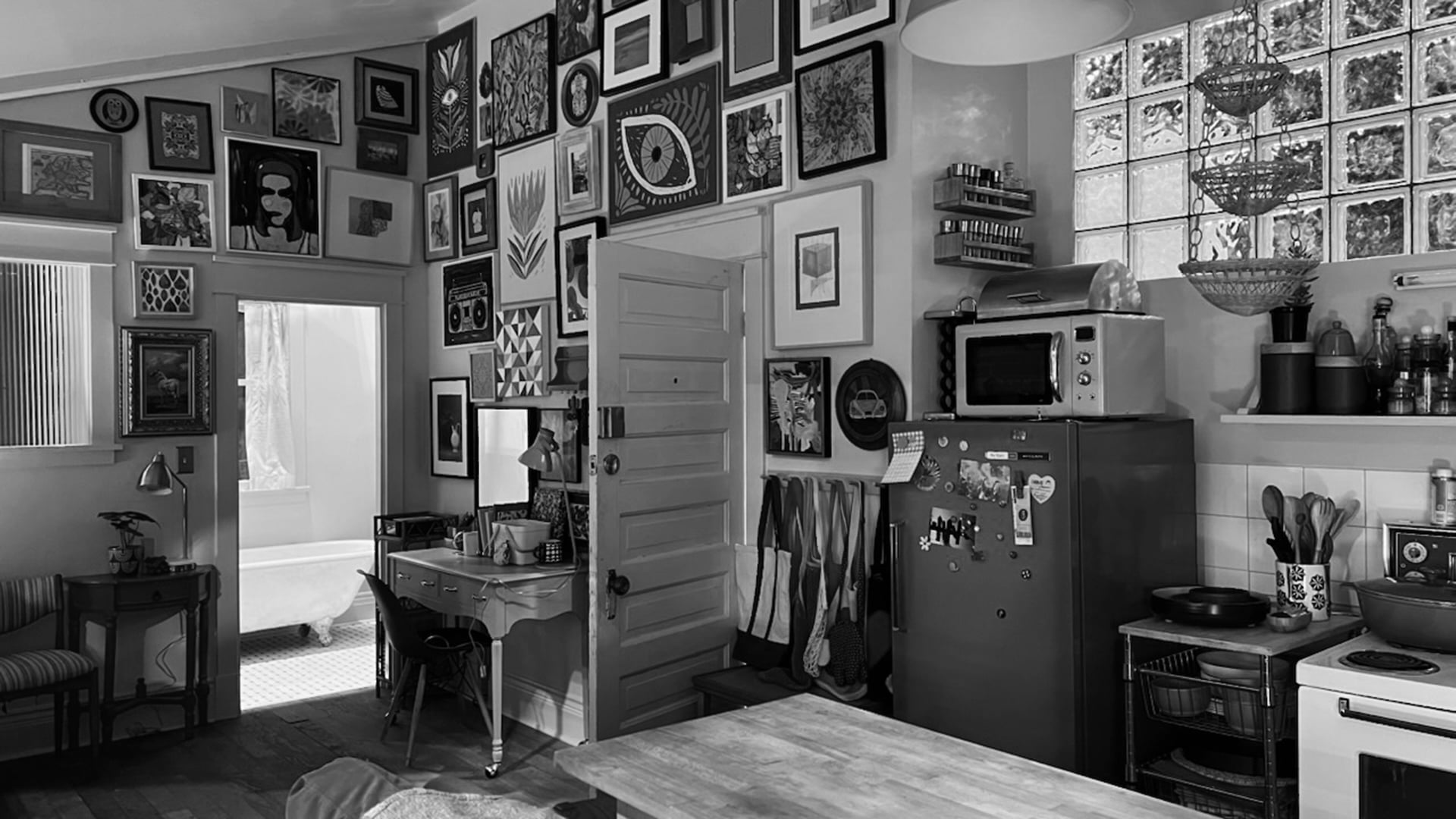Eclectic kitchen set with gallery wall of framed art, vintage green fridge, and glass block windows for Meta Quest 3 commercial