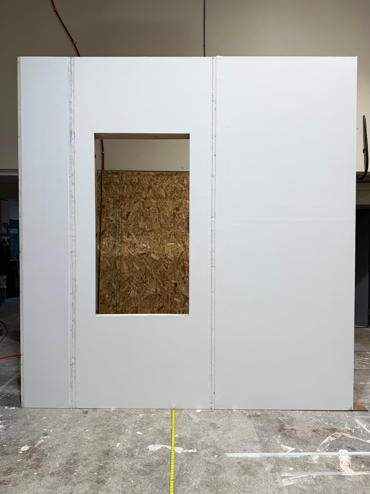 Seamless wall panel with window cutout displayed in workshop