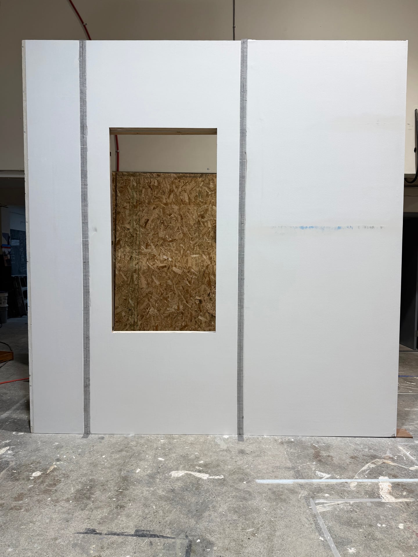 Seamless wall panel with window cutout displayed in workshop