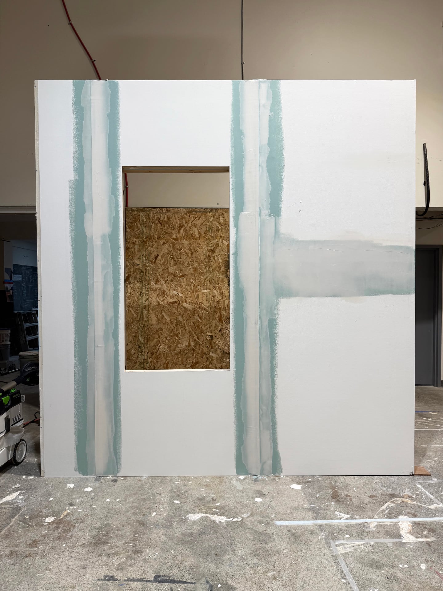 Seamless wall panel with window cutout displayed in workshop